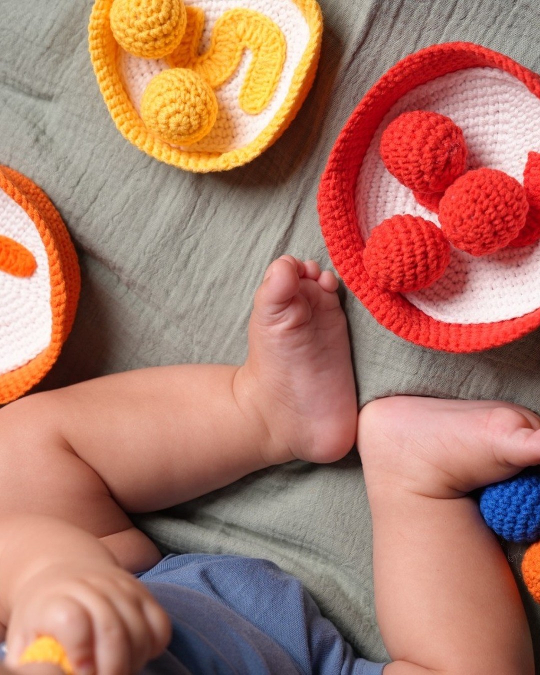 Close-up of crochet count-and-sort bowls with numbered centres