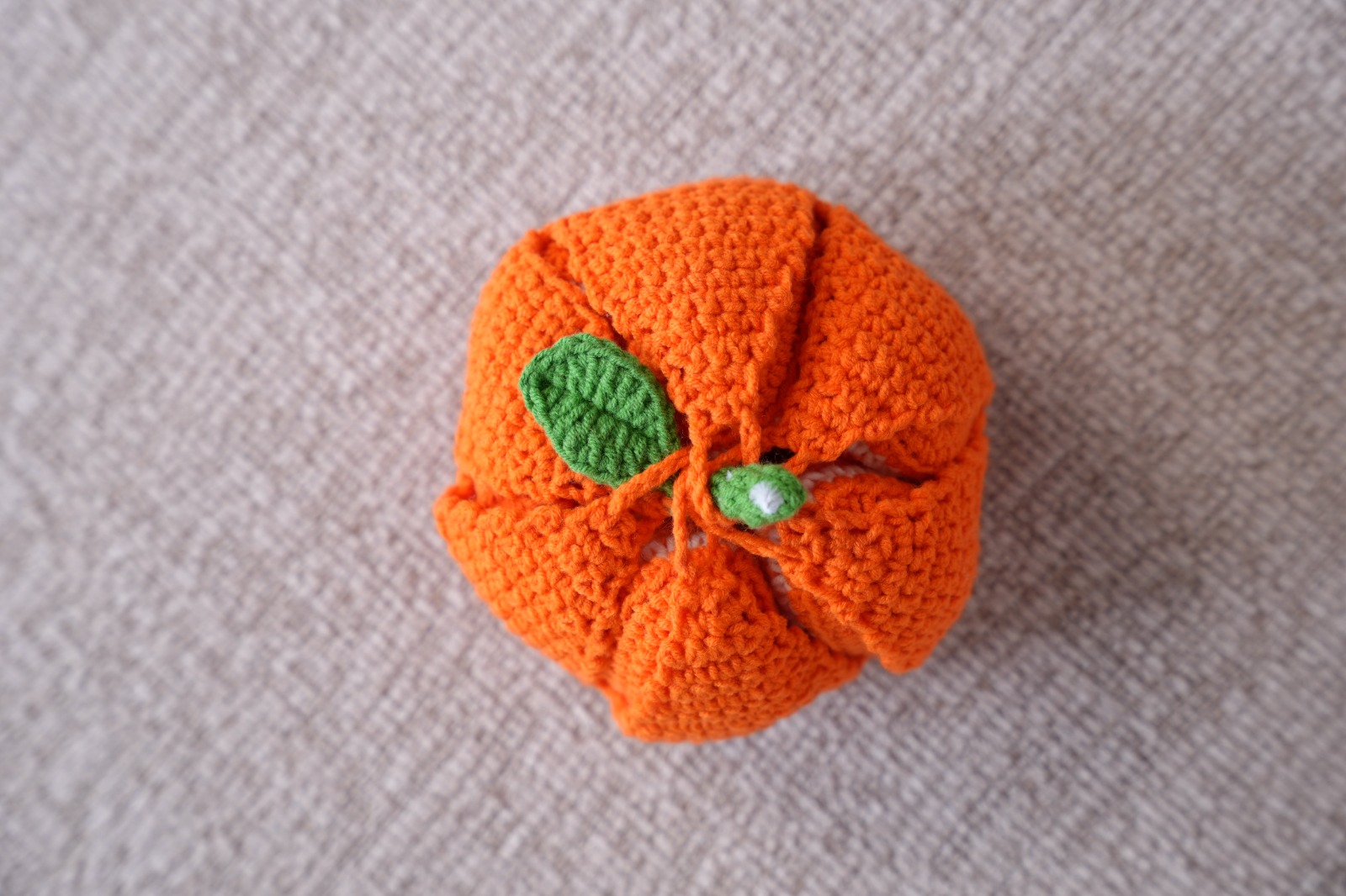Handmade peelable crochet orange with green leaf