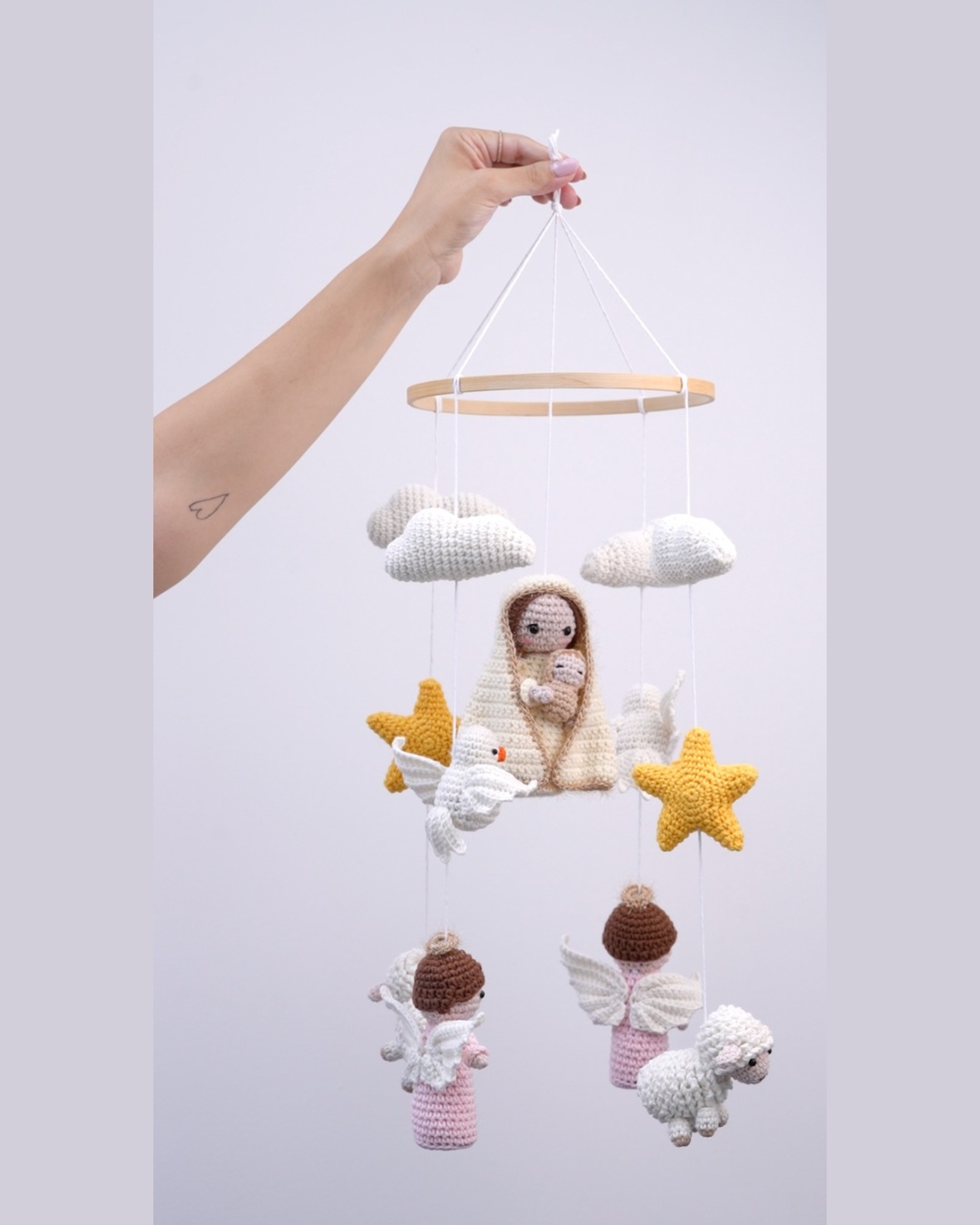 Crochet nativity nursery mobile with Mary and child, an angel, a sheep and a star