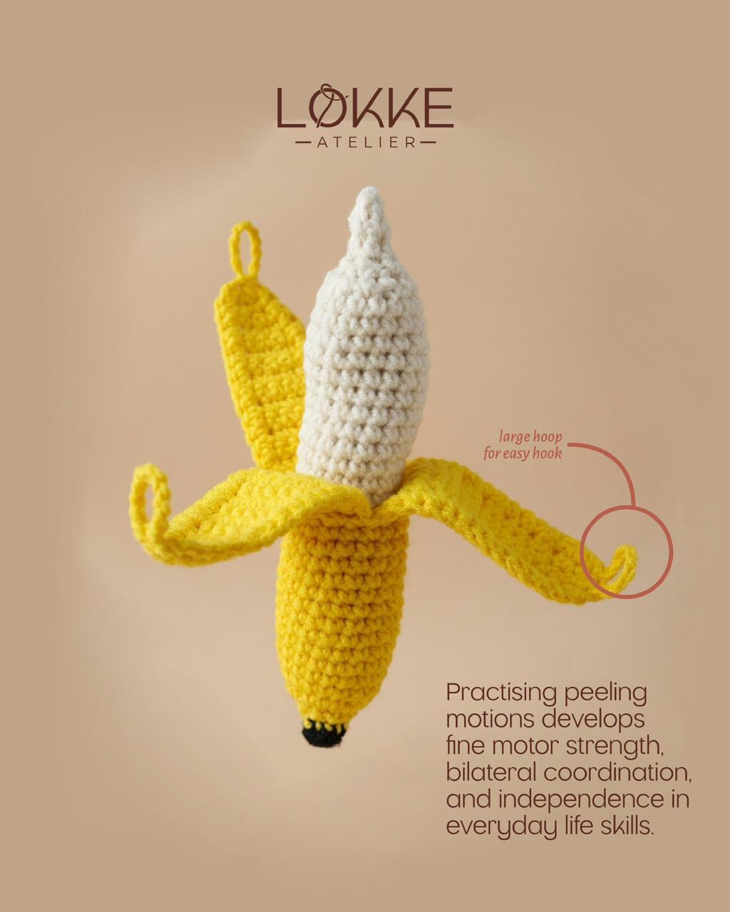 Handmade peelable crochet banana with large hoops on the peel flaps