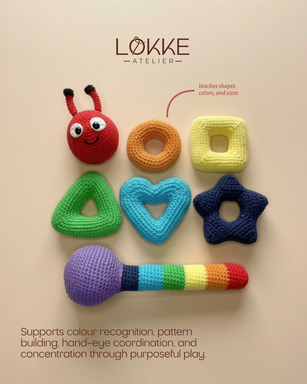 Unassembled Wiggly Caterpillar: head, shape rings and rainbow rattle body